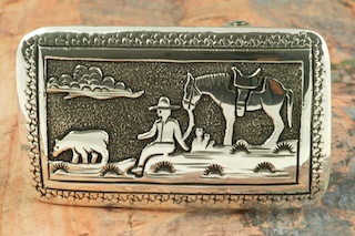 Beautiful Cowboy and Horse Design in this Sterling Silver Belt Buckle. Created by Navajo Artist Tommy Singer. Signed by the artist.